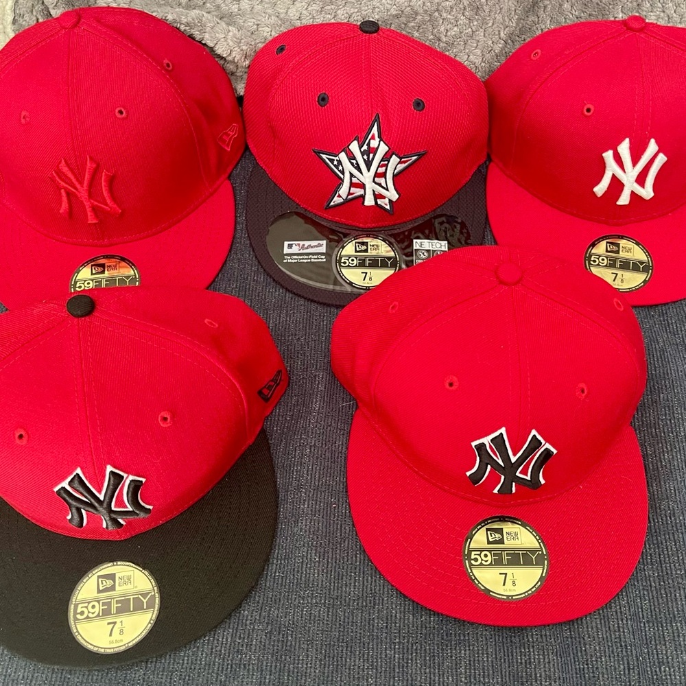 22 Brand new never worn New Era Yankees fitted hats.  Size 7 1/8